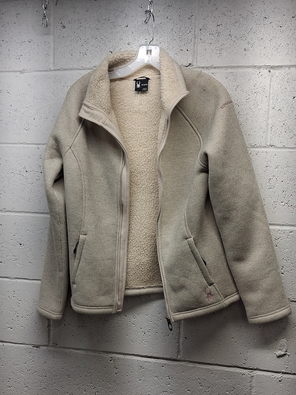 NWOT Spyder full-zip fleece jacket with soft sherpa lining and subtle logo